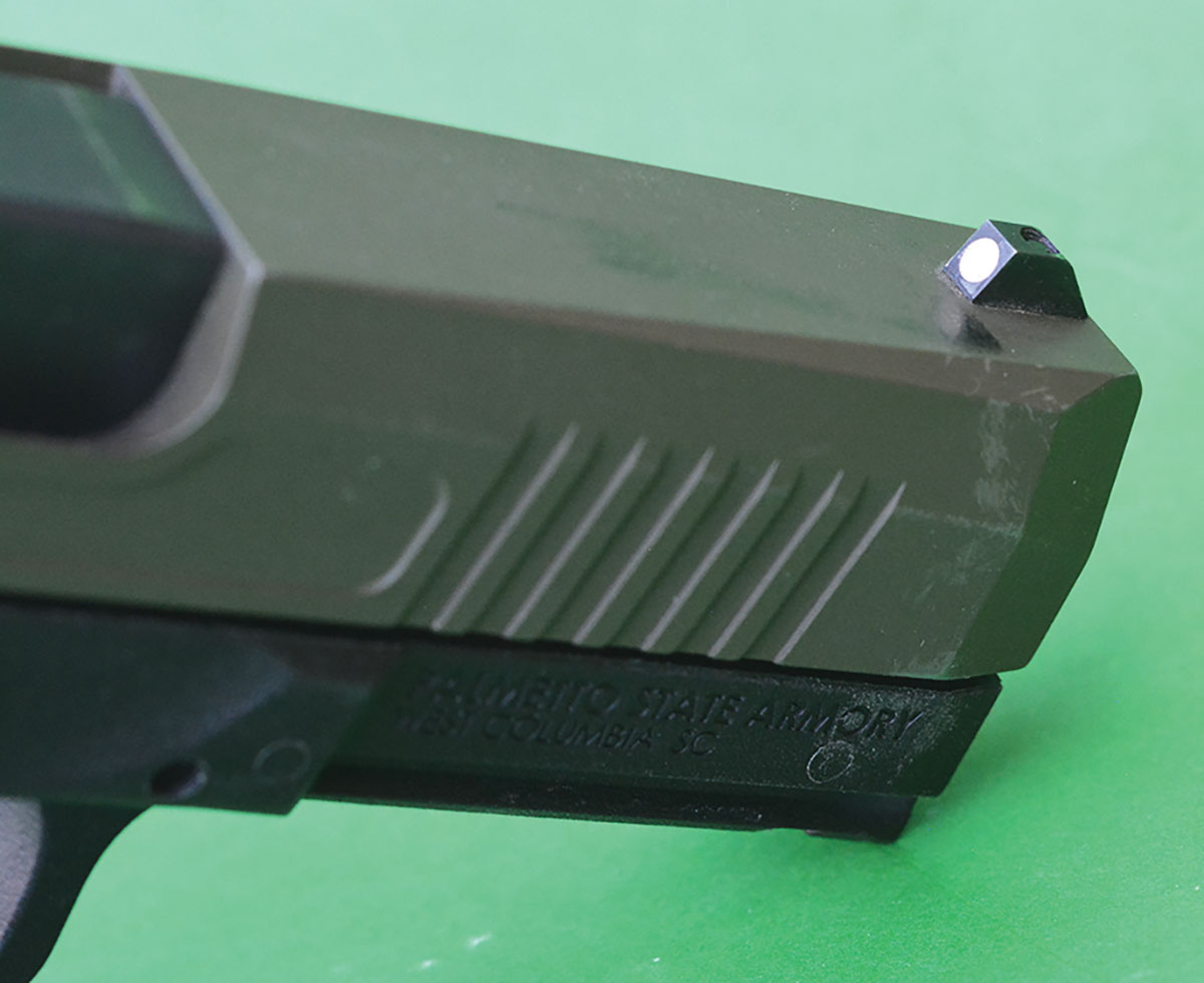 The front sight features a white dot.